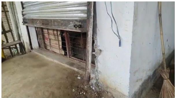 Theft by taking the liquor shop's watchman at gunpoint