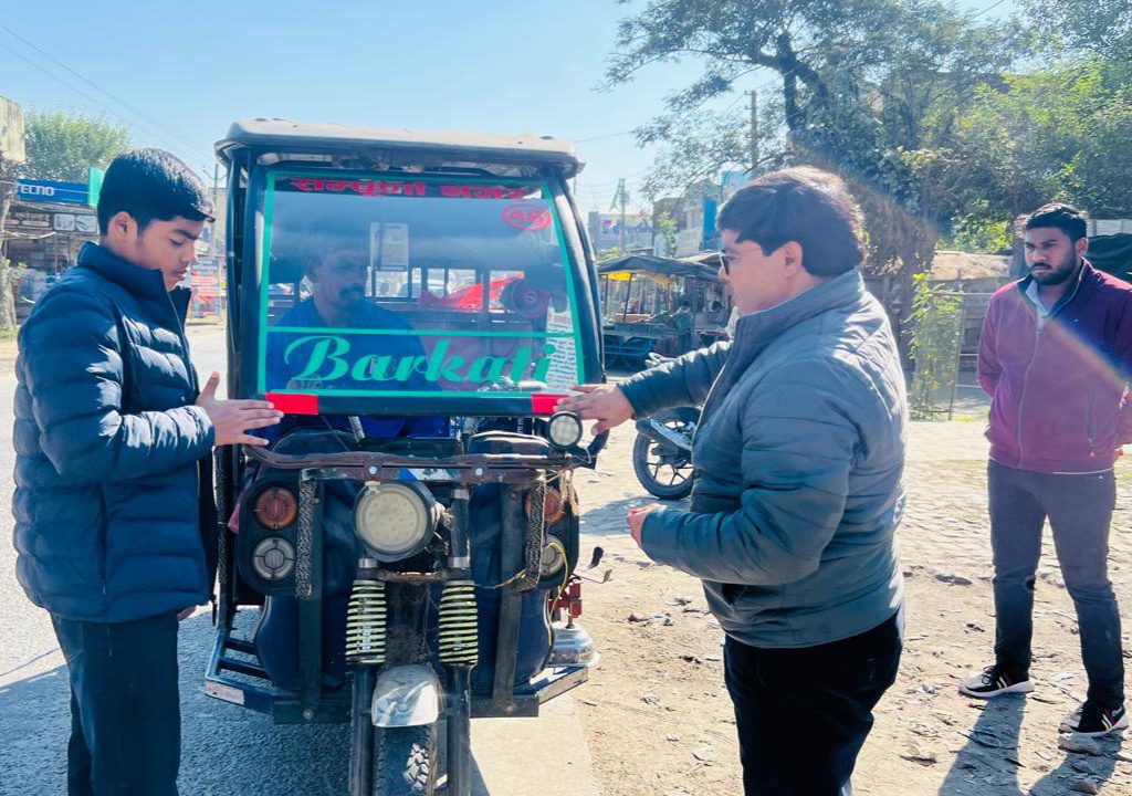 Social worker Dr. Khan, along with his son, installed radium in vehicles.
