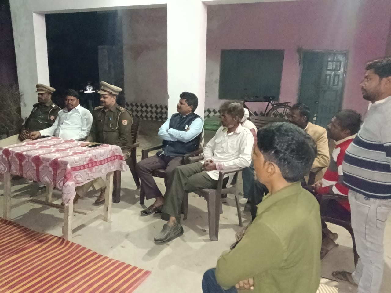Night Chaupal with villagers for crime control.