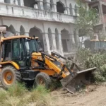 #BulldozerAction, #UPNews, #SantKabirNagar, #IllegalConstruction, #BreakingNews, #UttarPradesh, #LawAndOrder, #Demolition, #PoliceAction, #IndiaNews,संतकबीरनगर बुलडोजर खबर उत्तर प्रदेश, Sant Kabir Nagar demolition news UP India, illegal madrasa case Uttar Pradesh district news, bulldozer action UP government news, law and order news Sant Kabir Nagar UP, foreign funding case India UP news, breaking news Uttar Pradesh demolition action,bulldozer demolishing madrasa, Sant Kabir Nagar demolition images, UP police action visuals, illegal building demolition India, बुलडोजर कार्रवाई फोटो, police deployment demolition site,Sant Kabir Nagar bulldozer action, UP illegal madrasa demolition, Shamsul Huda Khan news, bulldozer action UP news, Uttar Pradesh illegal construction, foreign funding madrasa case, संतकबीरनगर खबर, यूपी बुलडोजर कार्रवाई, illegal property demolition India,
