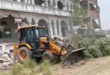 #BulldozerAction, #UPNews, #SantKabirNagar, #IllegalConstruction, #BreakingNews, #UttarPradesh, #LawAndOrder, #Demolition, #PoliceAction, #IndiaNews,संतकबीरनगर बुलडोजर खबर उत्तर प्रदेश, Sant Kabir Nagar demolition news UP India, illegal madrasa case Uttar Pradesh district news, bulldozer action UP government news, law and order news Sant Kabir Nagar UP, foreign funding case India UP news, breaking news Uttar Pradesh demolition action,bulldozer demolishing madrasa, Sant Kabir Nagar demolition images, UP police action visuals, illegal building demolition India, बुलडोजर कार्रवाई फोटो, police deployment demolition site,Sant Kabir Nagar bulldozer action, UP illegal madrasa demolition, Shamsul Huda Khan news, bulldozer action UP news, Uttar Pradesh illegal construction, foreign funding madrasa case, संतकबीरनगर खबर, यूपी बुलडोजर कार्रवाई, illegal property demolition India,